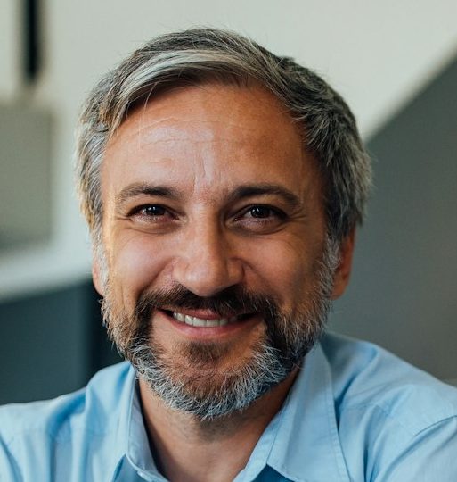 Portrait of men in a blue shirt with happy face.